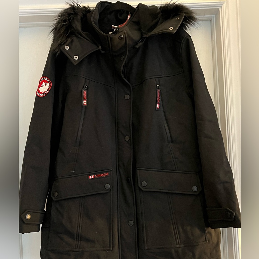 NWT Black Winter Jacket with a detachable hood.
